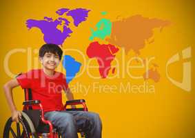 Disabled boy in wheelchair in front of colorful world map