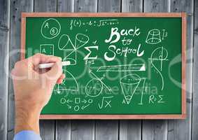 Hand drawing back to school diagrams on blackboard