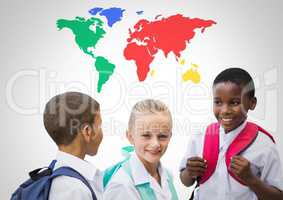School kids laughing in front of colorful world map