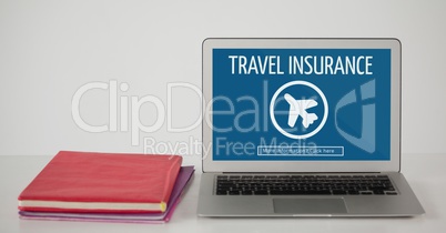 Computer with travel insurance concept on screen