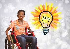Disabled boy in wheelchair with idea light bulb
