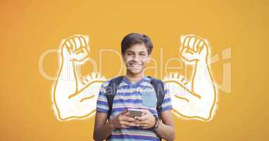 Happy student boy with fists graphic using a phone against yellow background