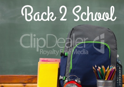 Schoolbag on Desk foreground with blackboard graphics of Back 2 School