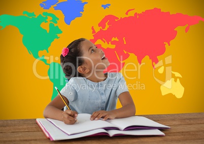 Schoolgirl writing at desk in front of colorful world map