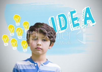 Boy in front of colorful idea and light bulb graphics