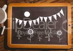 flowers sun and flags on blackboard