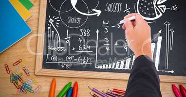 Hand writing math strategy success text on blackboard