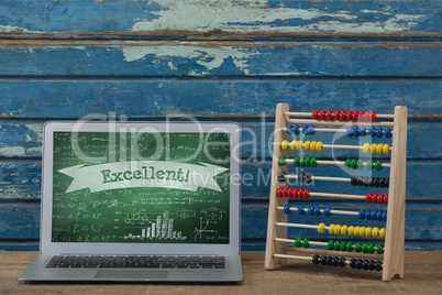 Computer on a school table with school icons on screen