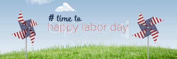 Happy labor day text and USA wind catchers in front of grass and sky