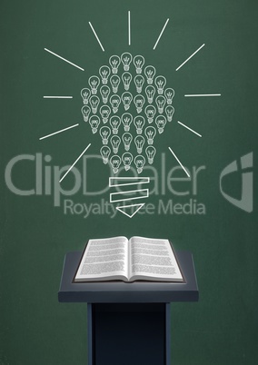 Book on speech table against green blackboard with bulb graphic