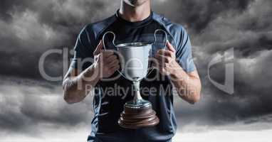 Man with a trophy on hands