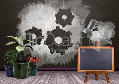 Blackboard and plants with setting cog gears on blackboard
