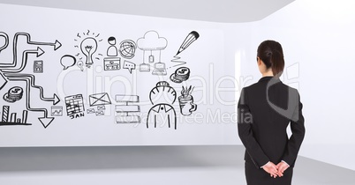 Business woman standing in a 3D room with a conceptual graphic on the wall