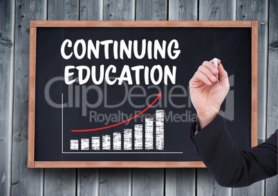 Hand writing Continuing education on blackboard