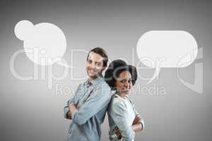 Couple with speech bubble standing against grey background