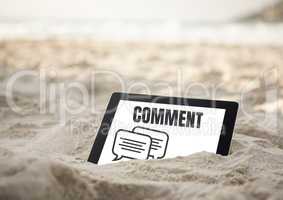 Comment text and chat graphic on tablet screen in sand on beach