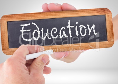 Hand writing Education text on blackboard