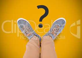 Question mark and Grey shoes on feet with yellow background