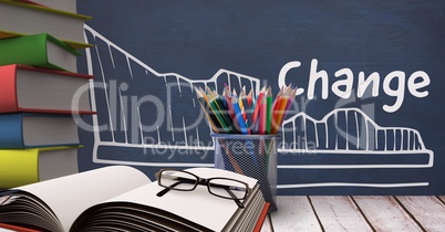 Books on the table against blue blackboard with education and school graphics