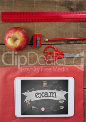 Tablet on a school table with school icons on screen