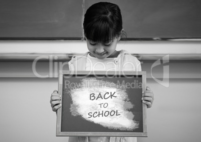 back to school text and girl holding sign