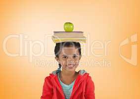 Girl with books and apple on head in front of orange background