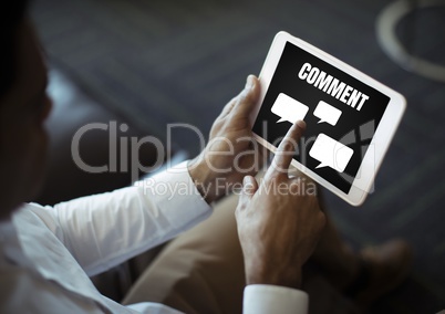 Comment text and chat graphic on tablet screen with mans hands