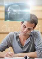 Male Student studying with notes and science education interface graphics overlay