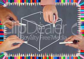 Hands drawing cube on blackboard with coloring pencils