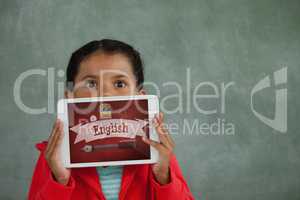 Girl holding a tablet with school icons on screen