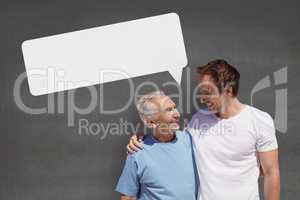 Father and son with speech bubble against grey background