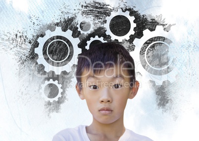 Boy in front of settings wheels cog