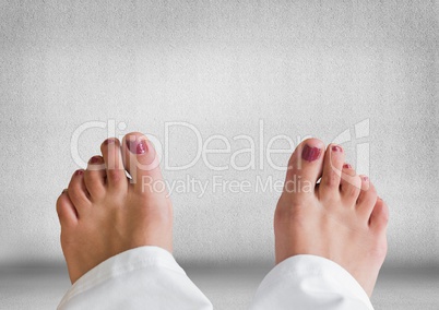 Bare feet and grey stone background