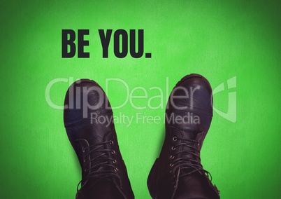Be you text and Black shoes on feet with green background