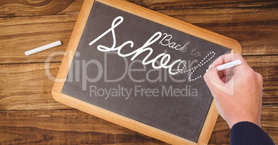 Back to school text on blackboard with chalk