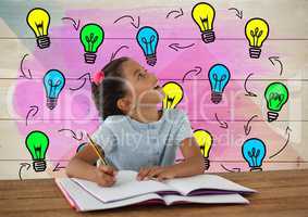 Schoolgirl writing at desk with colorful light bulbs graphics