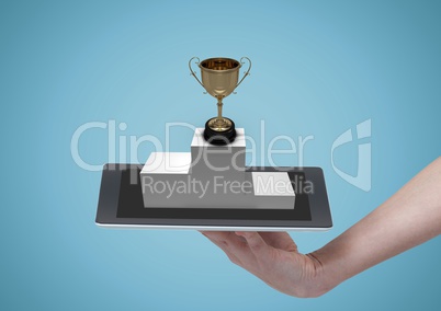 Person holding a tablet with a trophy