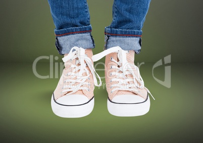 Beige shoes on feet with green background
