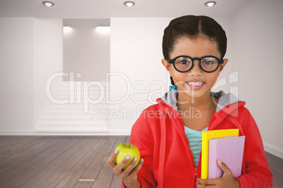 Composite image of girl holding books and apple