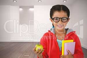 Composite image of girl holding books and apple