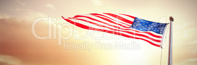 Composite image of american flag waving over white background