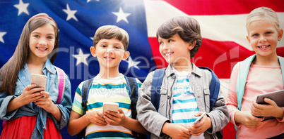 Composite image of portrait of children holding mobile phones