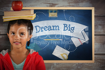 Composite image of girl balancing books and apple on head