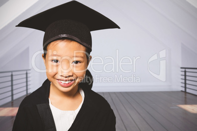 Composite image of portrait of smiling girl wearing mortarboard