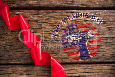 Composite image of happy labor day text over cropped hand holding tools