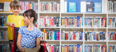 Composite image of cute pupils at the library