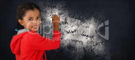 Composite image of portrait of smiling girl holding chalk