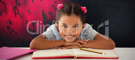 Composite image of girl clenching teeth while leaning on book