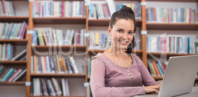 Composite image of student on laptop