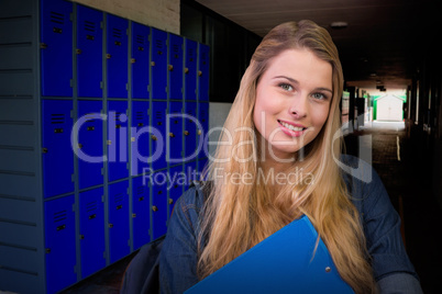 Composite image of pretty student in the library